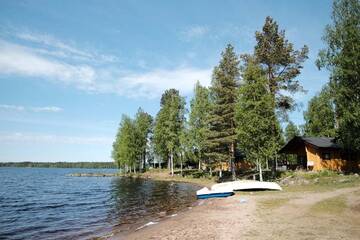 Фото номера Шале с 3 спальнями Кемпинги Marjoniemi Camping г. Hiidenniemi 18